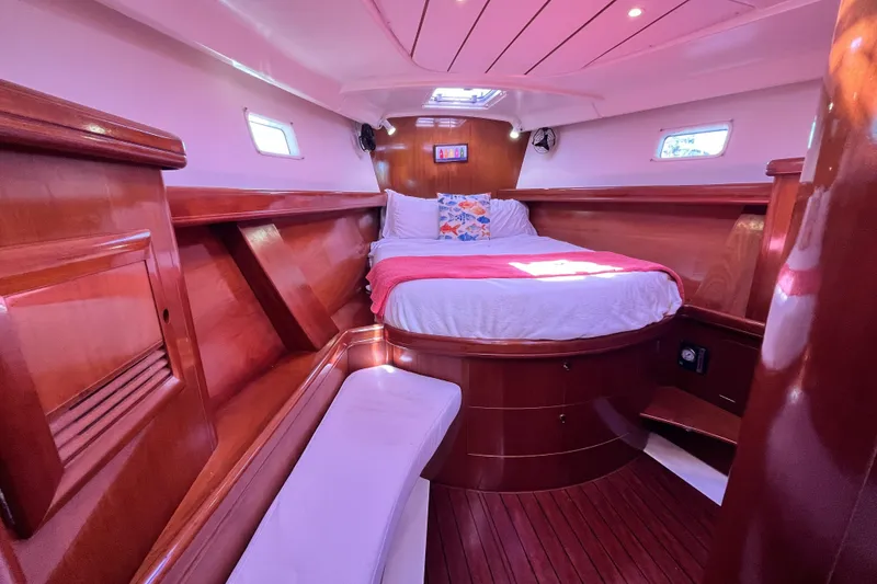 Slide: The Image of Luxurious cabin interior of 2001 Beneteau 473 yacht with polished wood finish. - 24