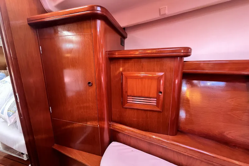 Slide: The Image of Wooden interior of 2001 Beneteau 473 yacht, featuring polished cabinetry and elegant design. - 26