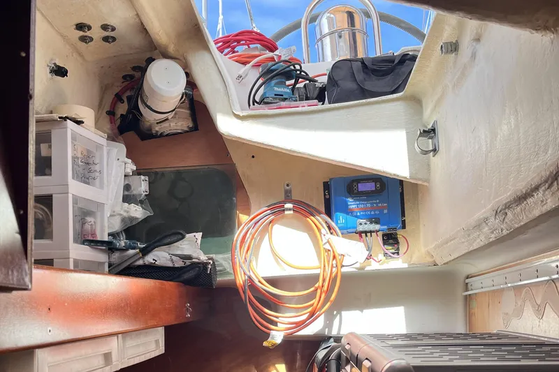 Slide: The Image of Interior of a 2001 Beneteau 473 sailboat with storage and electrical equipment. - 40
