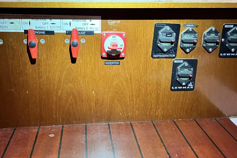 Slide: The Image of Electrical panel of a 2001 Beneteau 473 sailboat with switches and controls. - 42