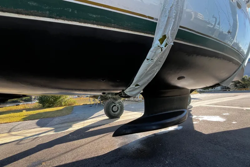 Slide: The Image of Bottom view of a 2001 Beneteau 473 sailboat on a trailer, showing the keel and hull. - 53