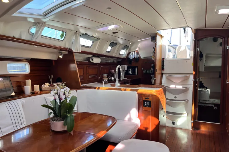 Slide: The Image of Luxurious interior of a 2001 Beneteau 473 yacht with elegant wood finishes and modern amenities. - 9