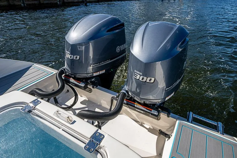 Slide: The Image of Twin Yamaha 300 engines on a 2021 Cobia 320 Center Console boat. - 13