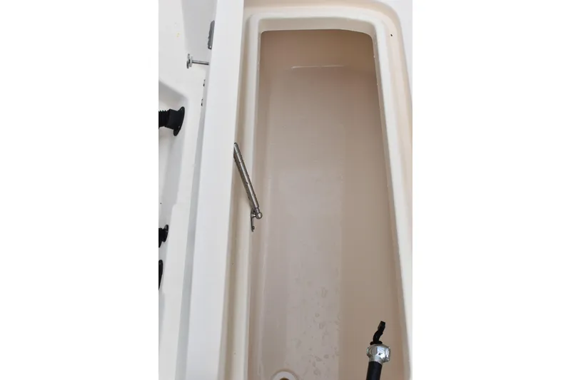 Slide: The Image of Fuel hose and compartment on 2012 Grady-White Canyon 271 boat. - 11