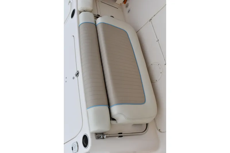Slide: The Image of Livewell on 2012 Grady-White Canyon 271 boat, featuring a clean, white interior. - 13