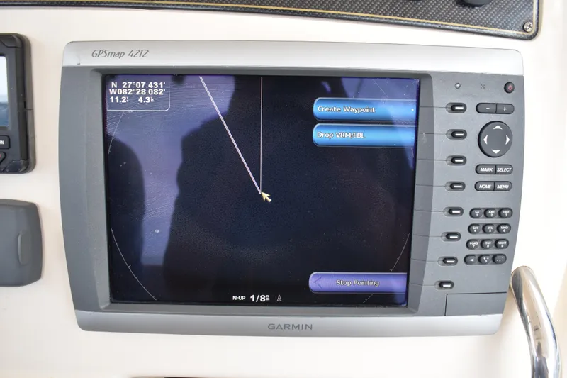 Slide: The Image of Storage compartment with tackle boxes on a 2012 Grady-White Canyon 271 boat. - 19