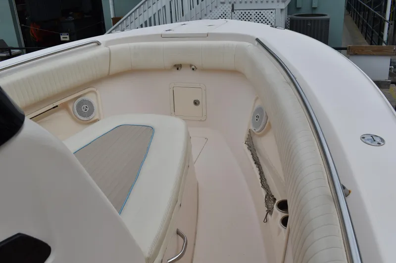 Slide: The Image of Control panel of 2012 Grady-White Canyon 271 boat with switches and logo. - 28