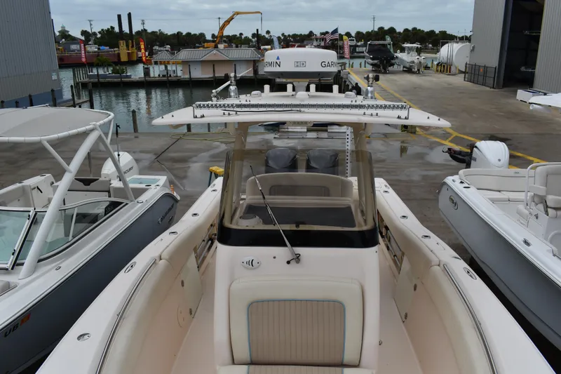 Slide: The Image of Garmin GPSmap 4212 display on 2012 Grady-White Canyon 271 boat, showing navigation details. - 33
