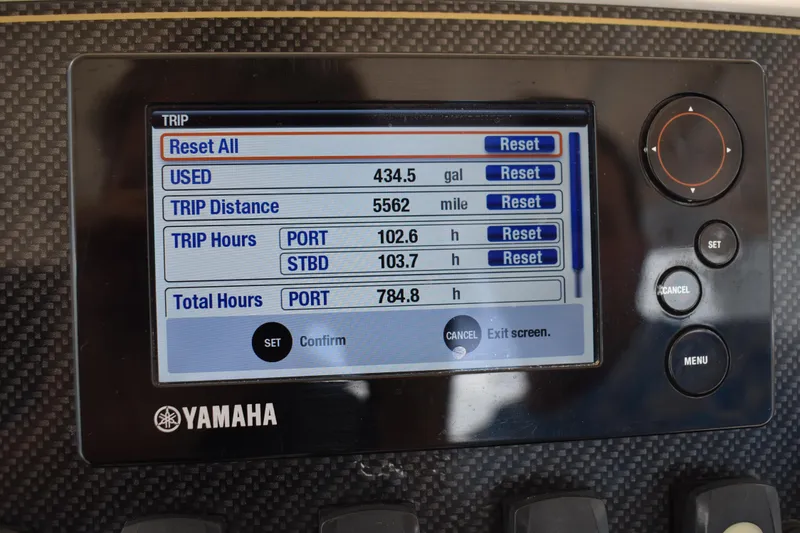 Slide: The Image of Bennett trim tab control panel on 2012 Grady-White Canyon 271 boat dashboard. - 36