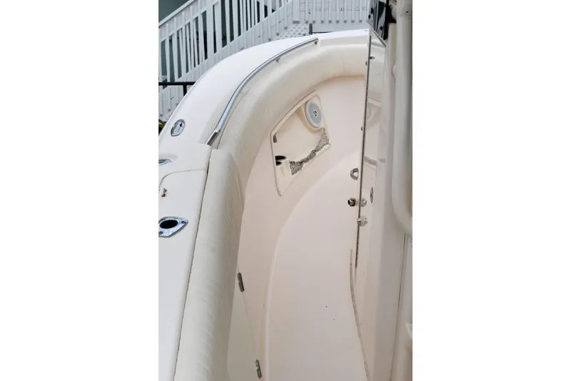 Slide: The Image of 2012 Grady-White Canyon 271 boat interior with seating and control panel. - 38