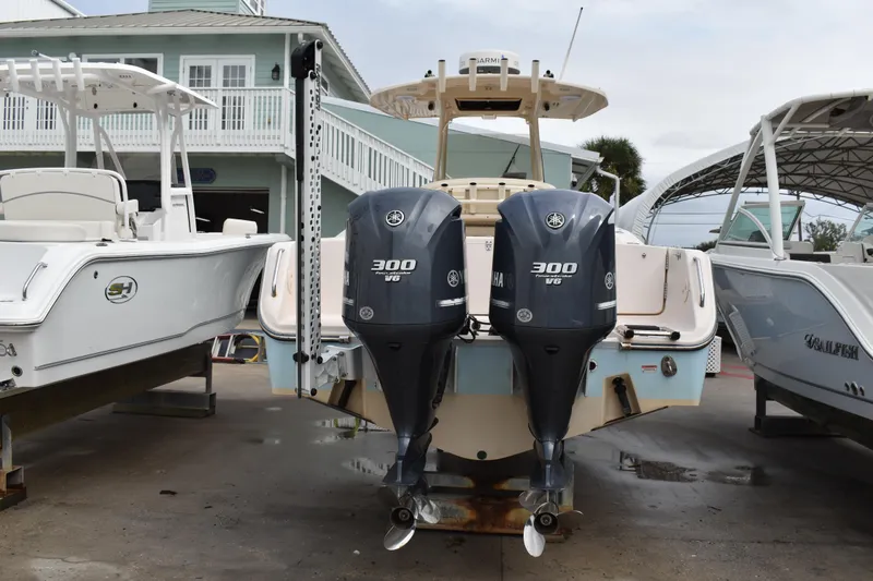 Slide: The Image of 2012 Grady-White Canyon 271 boat docked near industrial building. - 4