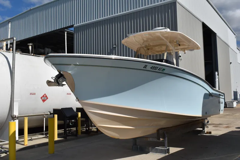 Slide: The Image of 2012 Grady-White Canyon 271 boat interior with white seating and railing. - 46