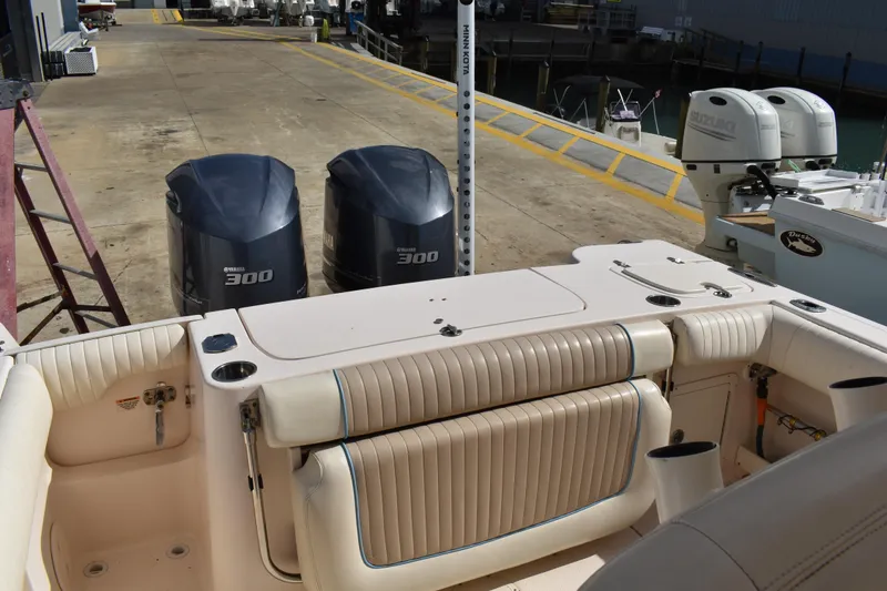 Slide: The Image of 2012 Grady-White Canyon 271 boat with twin Yamaha 300 V6 engines at dock. - 48