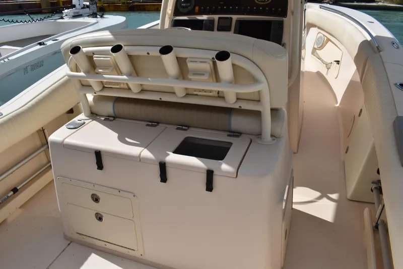 Slide: The Image of 2012 Grady-White Canyon 271 boat with twin Yamaha 300 engines docked by the water. - 49