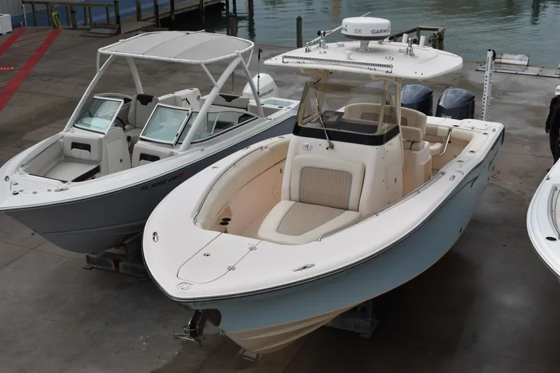 Slide: The Image of Twin Yamaha 300 outboard engines on a 2012 Grady-White Canyon 271 boat. - 8