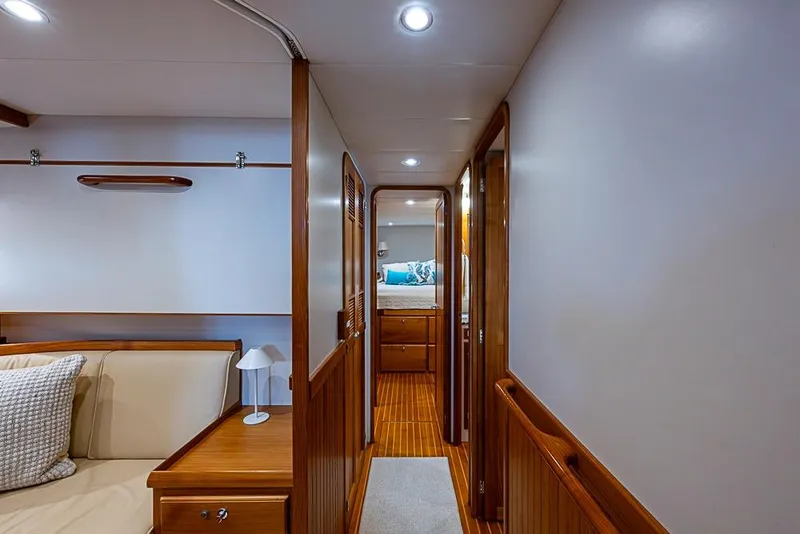 Slide: The Image of Luxurious interior of 2016 Kadey-Krogen 52 yacht with wood accents and cozy seating. - 24