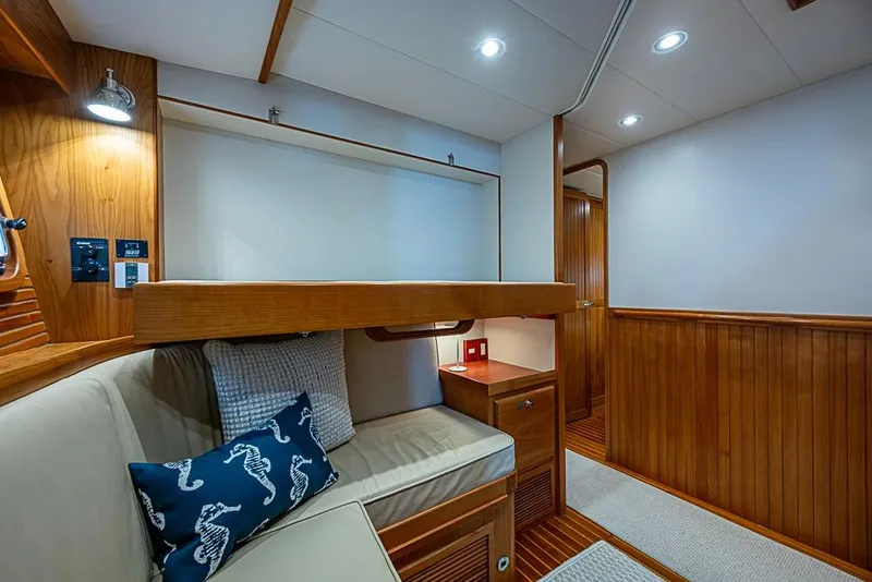 Slide: The Image of Cozy cabin interior of 2016 Kadey-Krogen 52 yacht with wooden paneling and bunk bed. - 41