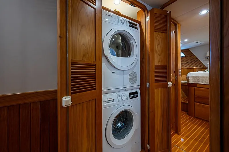 Slide: The Image of Laundry area with Bosch appliances in 2016 Kadey-Krogen 52 yacht interior. - 44