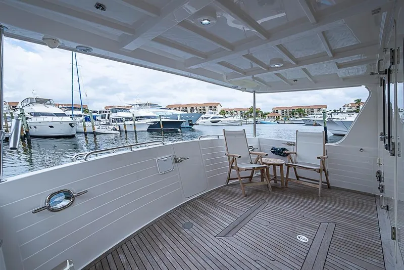 Slide: The Image of Luxurious 2016 Kadey-Krogen 52 yacht deck with marina view and seating area. - 45