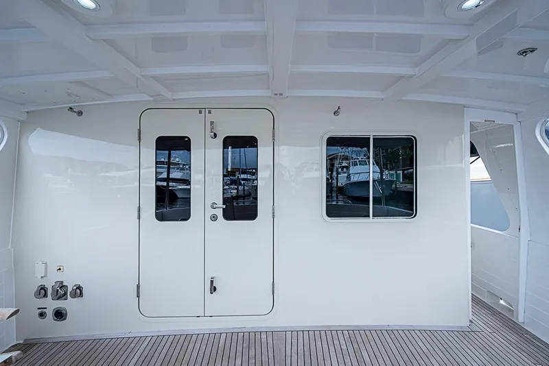 Slide: The Image of Kadey-Krogen 52 yacht interior, 2016 model, featuring sleek white doors and wood flooring. - 47