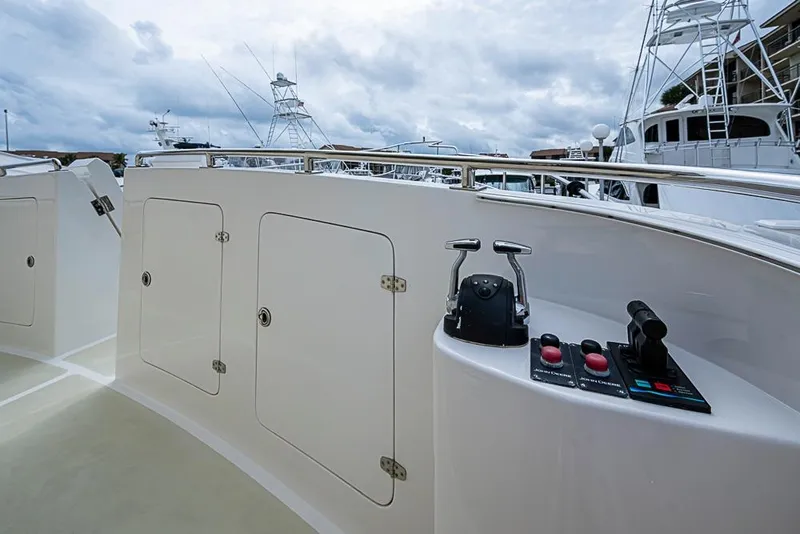 Slide: The Image of 2016 Kadey-Krogen 52 yacht deck with control panel and storage compartments. - 51