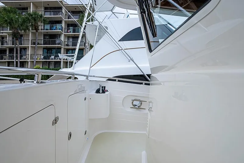 Slide: The Image of 2016 Kadey-Krogen 52 yacht deck with modern design and nearby buildings. - 52