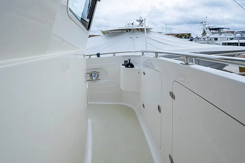 Slide: The Image of 2016 Kadey-Krogen 52 yacht deck with sleek white finish and railing. - 53