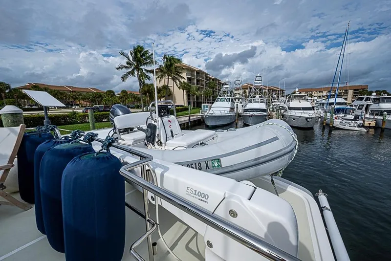 Slide: The Image of 2016 Kadey-Krogen 52 yacht docked with inflatable boat and marina view. - 60