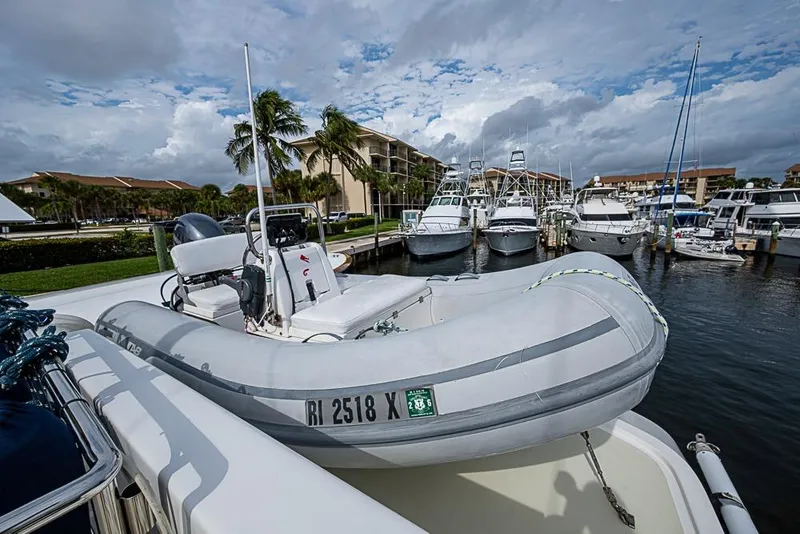 Slide: The Image of Inflatable boat on Kadey-Krogen 52 yacht, 2016, docked at marina with palm trees. - 63