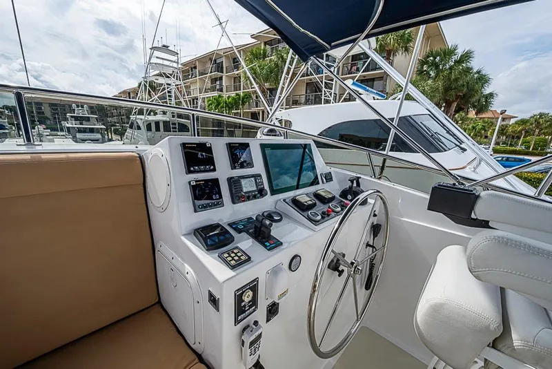 Slide: The Image of Helm of 2016 Kadey-Krogen 52 yacht with navigation controls and seating. - 67