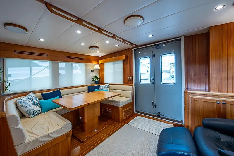 Slide: The Image of Luxurious interior of 2016 Kadey-Krogen 52 yacht with elegant wood finishes and cozy seating. - 7