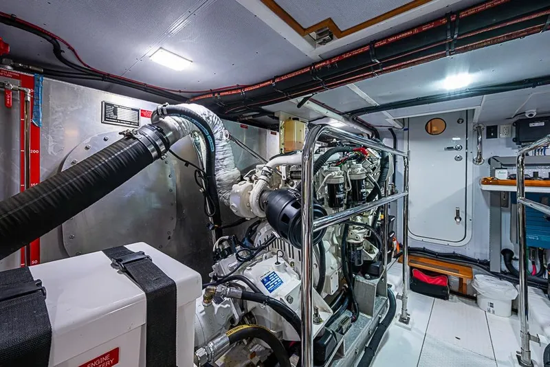 Slide: The Image of Engine room of 2016 Kadey-Krogen 52 yacht, featuring advanced machinery and equipment. - 78