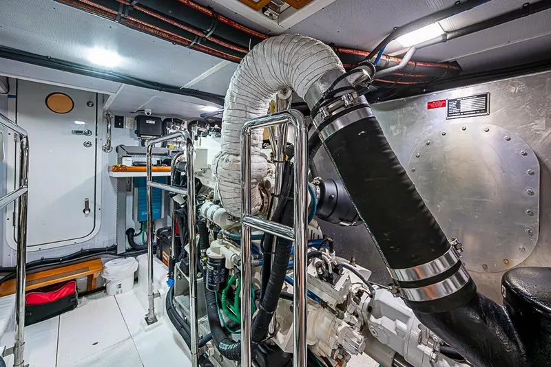 Slide: The Image of Engine room of 2016 Kadey-Krogen 52 yacht, featuring complex machinery and piping. - 79