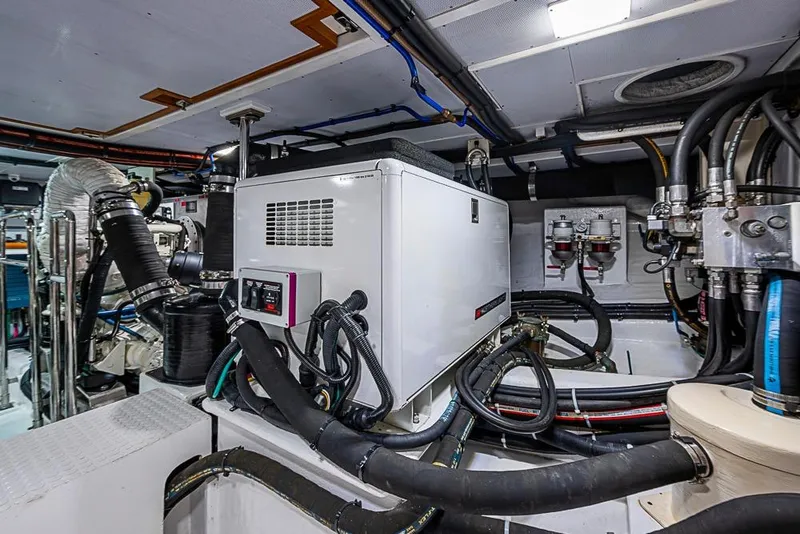 Slide: The Image of Engine room of 2016 Kadey-Krogen 52 yacht with generator and complex piping system. - 81
