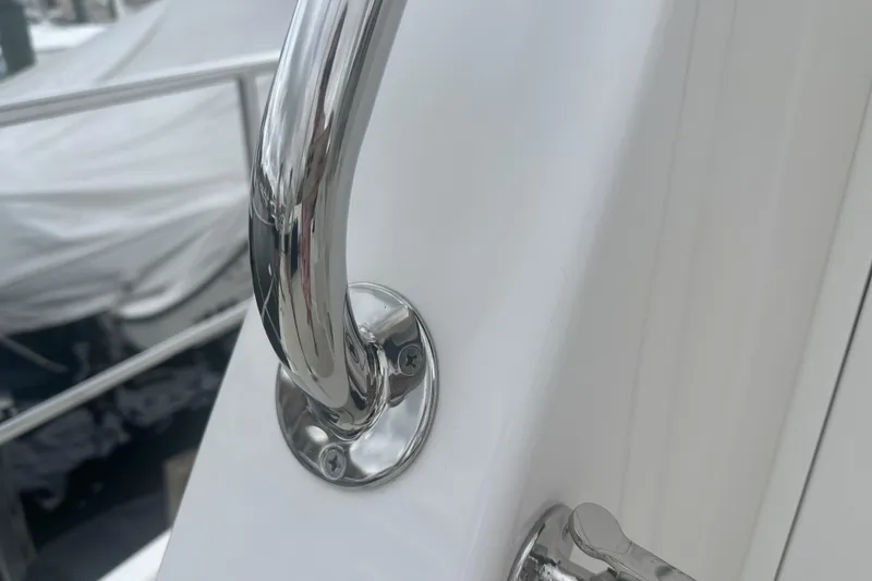 Slide: The Image of Chrome railing detail on a 2016 Kadey-Krogen 52 yacht, showcasing sleek design and craftsmanship. - 83