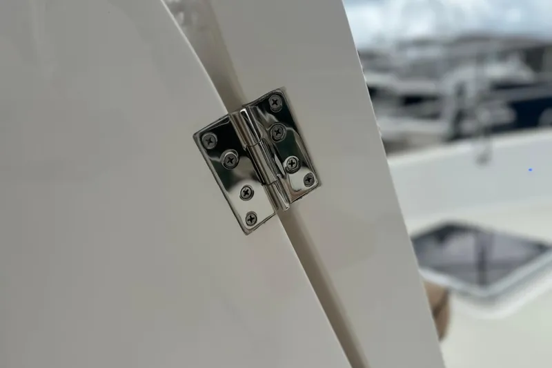 Slide: The Image of Close-up of a stainless steel hinge on a 2016 Kadey-Krogen 52 yacht. - 88