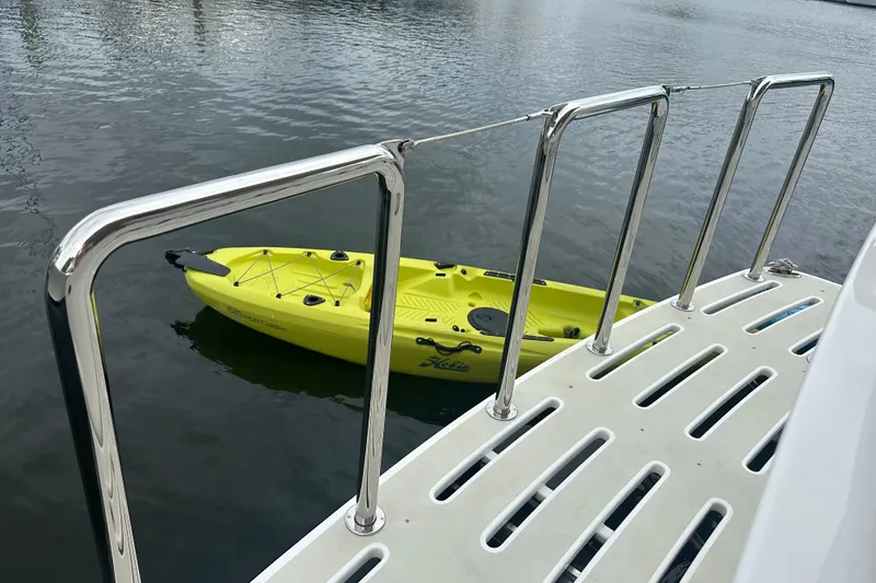 Slide: The Image of Kadey-Krogen 52 yacht with yellow kayak on water, 2016 model. - 89