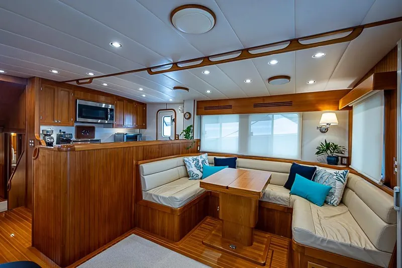 Slide: The Image of Luxurious 2016 Kadey-Krogen 52 yacht interior with elegant wood finish and cozy seating area. - 6