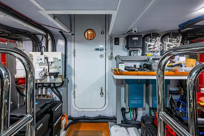 Slide: The Image of Engine room of a 2016 Kadey-Krogen 52 yacht, featuring equipment and control panels. - 76