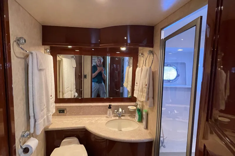 Slide: The Image of Bunk beds in 2006 Marquis 59 yacht cabin with wooden door and cozy bedding. - 13