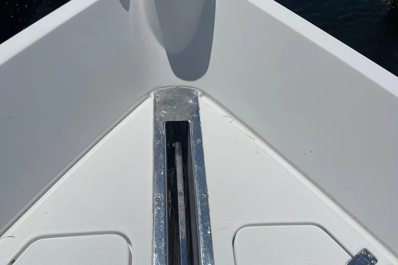 Slide: The Image of Luxurious 2006 Marquis 59 yacht helm with modern navigation equipment and plush seating. - 18