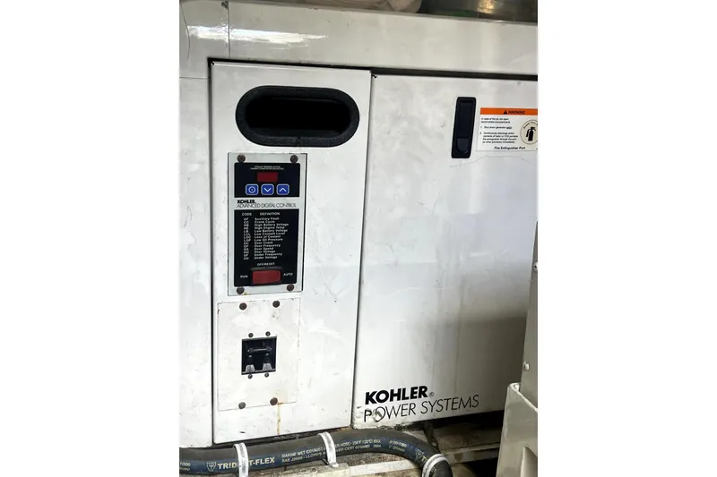 Slide: The Image of Helm of 2006 Marquis 59 yacht with navigation system and wooden steering wheel. - 19