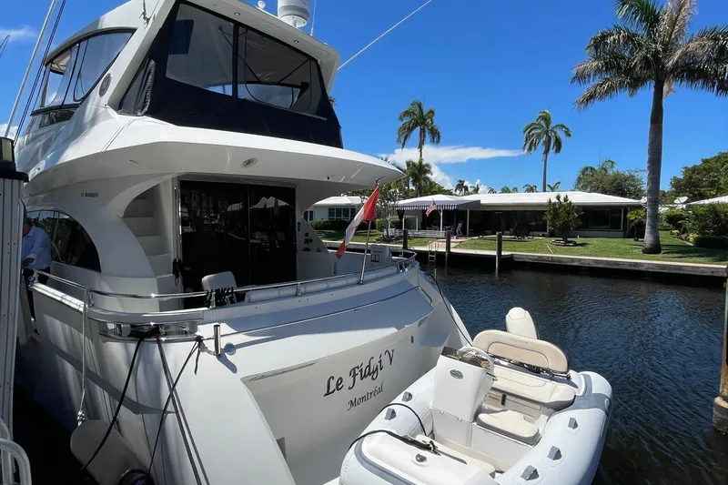 Slide: The Image of Luxurious 2006 Marquis 59 yacht interior with modern kitchen and cozy seating area. - 7