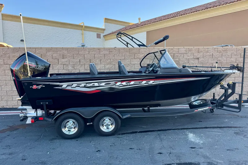 The Image of 2023 Tracker Targa V-19 WT boat on trailer, parked outdoors. - 0