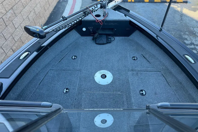 Slide: The Image of 2023 Tracker Targa V-19 WT boat deck with trolling motor and storage compartments. - 11