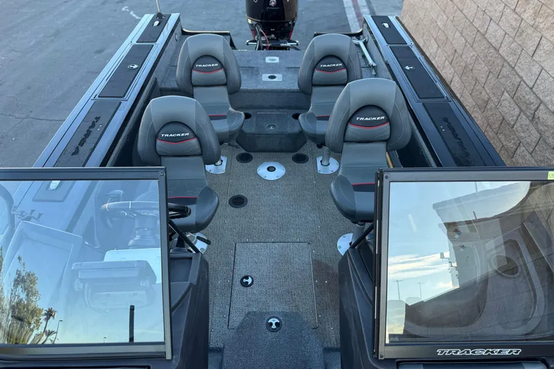 Slide: The Image of 2023 Tracker Targa V-19 WT boat interior with four seats and windshield. - 14