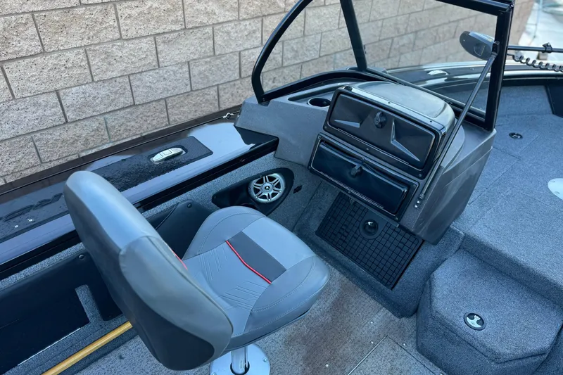 Slide: The Image of 2023 Tracker Targa V-19 WT boat interior with seating and dashboard. - 22