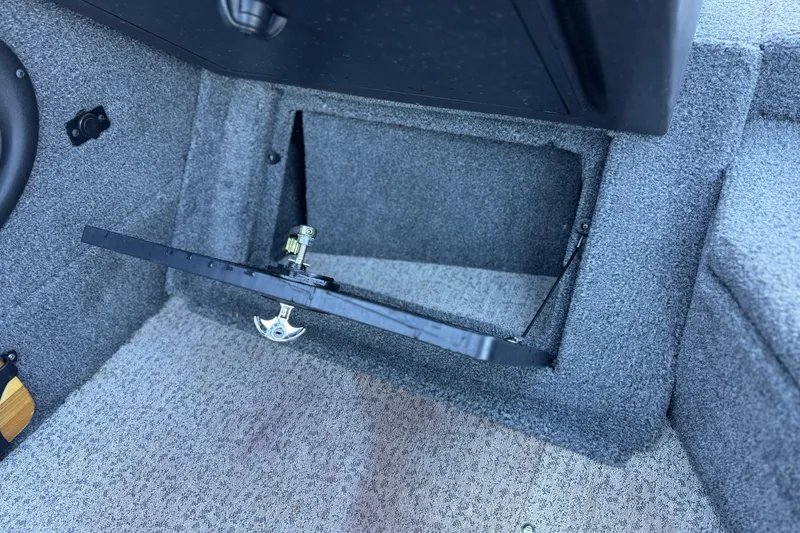 Slide: The Image of 2023 Tracker Targa V-19 WT boat interior storage compartment with open hatch. - 23