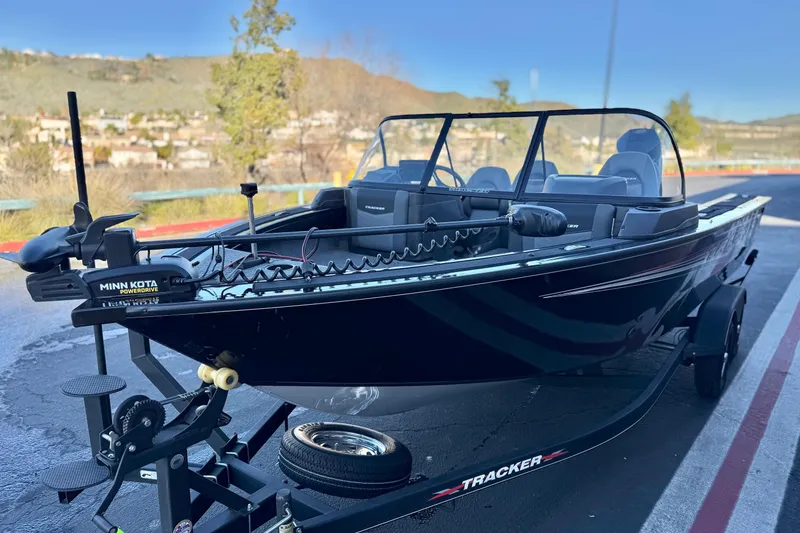 Slide: The Image of 2023 Tracker Targa V-19 WT boat on trailer, featuring Minn Kota PowerDrive motor. - 3