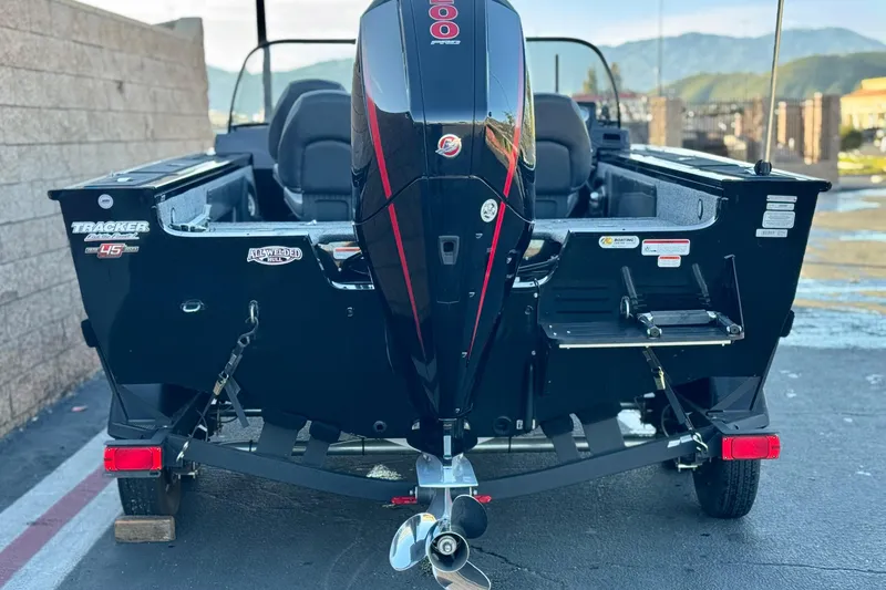 Slide: The Image of 2023 Tracker Targa V-19 WT boat with powerful outboard motor, parked outdoors. - 4